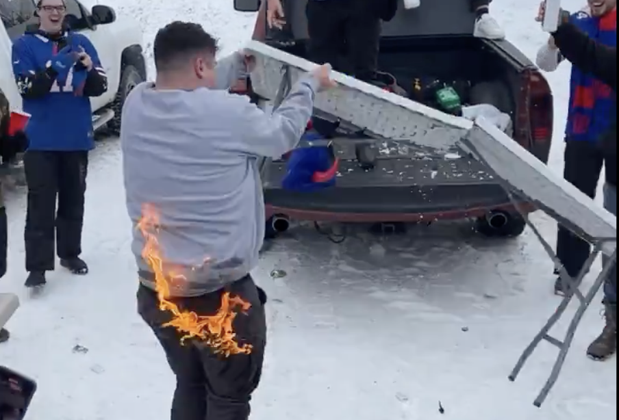 ‘Oh No!’ Fan Catches on Fire After Being Thrown Through a Flaming Table at Chaotic Bills Tailgate